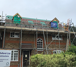 brick house having a temporary roof assembled