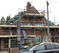 brand new home construction surrounded by scaffolding
