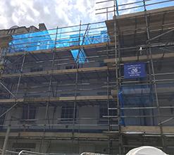 commercial scaffolding which includes multi-layered catwalks