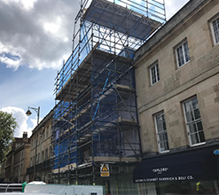 street-side scaffolding structure with safety netting