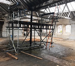 indoors scaffolding structure inside a dilapidated building