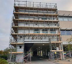 large commercial building with several catwalks surrounding it