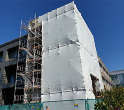 large commercial structure covered with a temporary roof